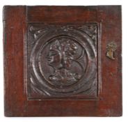 16th Century carved oak Romayne panel, with a profile facing right inside a circular frame and