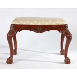 George III style mahogany stool, the drop in seat above shell capped and acanthus leaf carved