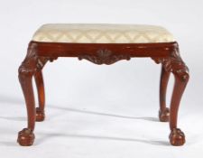 George III style mahogany stool, the drop in seat above shell capped and acanthus leaf carved