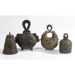 A collection of Chinese bronze bells, to include a crescent shaped example with an archaistic