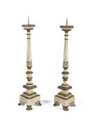 Pair of Italian pricket sticks, painted in white and green with traces of gilt, the spike top