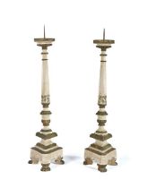 Pair of Italian pricket sticks, painted in white and green with traces of gilt, the spike top