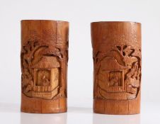 Pair of Chinese late 19th Century bamboo brush pots, both carved with figural pagoda scenes among