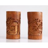 Pair of Chinese late 19th Century bamboo brush pots, both carved with figural pagoda scenes among