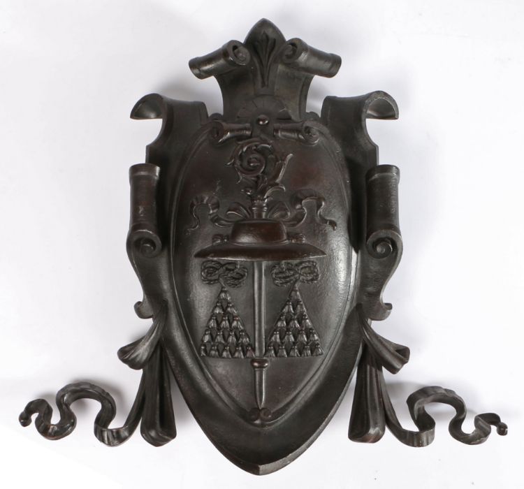 Catholic bronze shield, the centre of the shield with a Galero hat with tassels and staff, scrolling