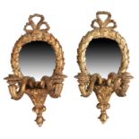 Pair of 18th Century gilt gesso girandole wall mirrors, surmounted with ribbon tops above a oval