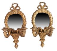 Pair of 18th Century gilt gesso girandole wall mirrors, surmounted with ribbon tops above a oval