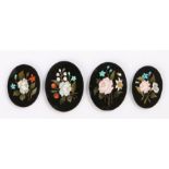 Four 19th Century Pietra Dura inlaid panels, each inlaid with a sprig of flowers, the smallest