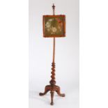 Victorian mahogany pole screen, the finial top above a woolwork foliate screen and long stem above