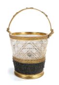 Late 19th / early 20th century cut glass ice bucket, the swing handle with applied grapes and