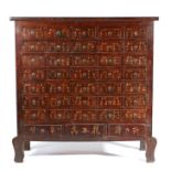 A large Oriental medicine cabinet, the rectangular top above a short cornice and a series of