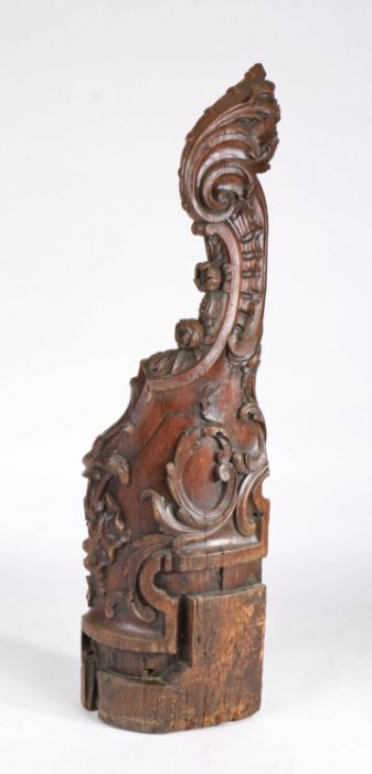 18th Century newel post, the scroll top above C scrolls and flowers heads to the curling post, now