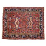 Persian Dozar Ardabil rug, centred with two motifs on beige and red ground, within patterned