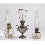 Richard Evered & Sons oil lamp, with clear glass chimney and shade mount above a silver plated