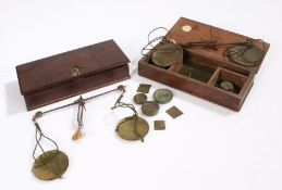 Two 19th Century apothecary scale sets, the rectangular boxes containing the brass pans, steel beams
