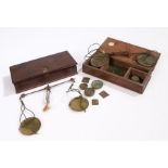 Two 19th Century apothecary scale sets, the rectangular boxes containing the brass pans, steel beams