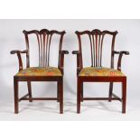 Pair of George III style mahogany elbow chairs, the reeded cresting rails above pierced splats,