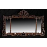 Victorian walnut overmantel mirror, the pierced shell, scroll and foliate carved frame housing three