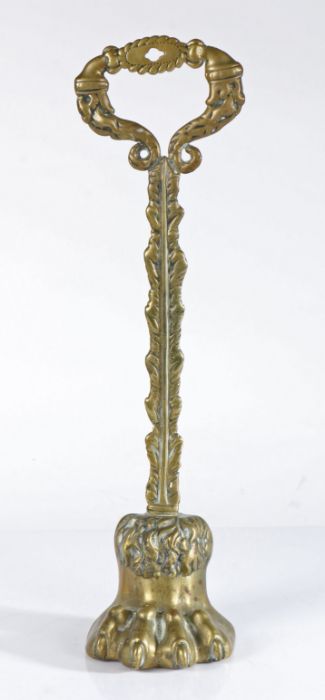 Victorian door stop, with a handle above the stem and lion paw foot, 42.5cm high