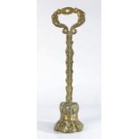 Victorian door stop, with a handle above the stem and lion paw foot, 42.5cm high