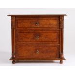 Victorian oak miniature chest of drawers, the rectangular top above three long strung graduated
