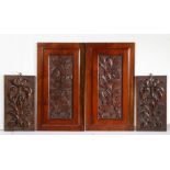 Pair of late 19th Century carved mahogany panels of floral design, together with two further smaller