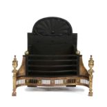 Regency fire basket, the iron back with a shell surmounting the basket fronted by a brass front, two