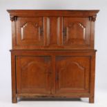 18th Century oak court cupboard, the rectangular top above drop finials and a pair of fielded arched