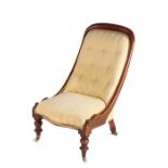 Victorian mahogany nursing chair, the arched top rail above a pad button back and stuff over seat