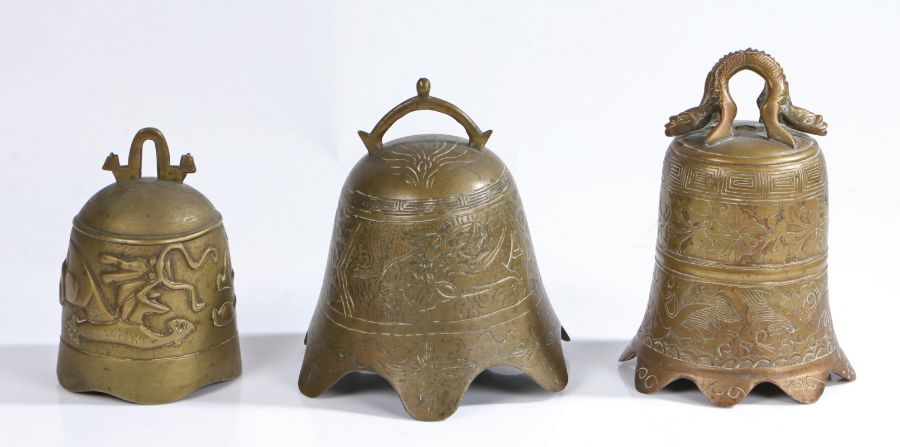 Three Chinese brass bells, to include an example with a stylised dragon, another with a flared - Image 2 of 2