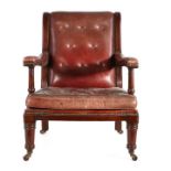 William IV mahogany and leather upholstered library armchair, the arched button back above a leather