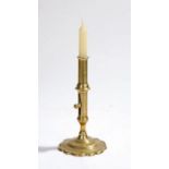 18th Century brass ejector candlestick, English, with a collared nozzle above the push up ejector on