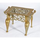 Victorian brass footman, the pierced gothic style top flanked by two rope twist effect handles, with