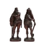 Pair of large late 19th Century oak carved figures, as standing Germanic Huntsmen/Woodsman, the