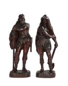 Pair of large late 19th Century oak carved figures, as standing Germanic Huntsmen/Woodsman, the