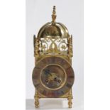 17th Century style brass lantern Clock, the final top above a bell and dolphin fret mounts, the