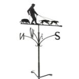 Metal weather vane, with a man with his dog, N.S.E.W. by blacksmith Graham Chaplin, 179cm long