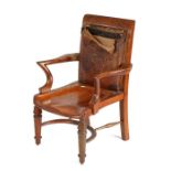 Edwardian oak desk chair, of large and deep proportions, the leather upholstered back above shaped