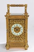 Early 20th Century brass carriage clock, the case with reeded pilasters flanking a pierced