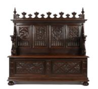 Gothic style oak hallway bench, the pediment with leaf capped arches flanked by turned finials above