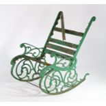 20th Century iron framed garden rocking chair, with a slat back and seat (AF) flanked by scroll side