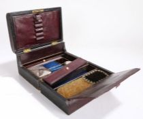 Victorian leather clad traveling box, the hinged lid with a sunken handle opening to reveal a pen