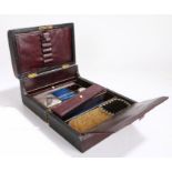 Victorian leather clad traveling box, the hinged lid with a sunken handle opening to reveal a pen