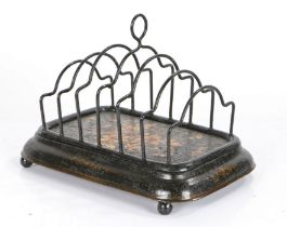 19th Century Pontypool toleware toast rack, the seven bar rack with flower decoration above a