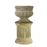 Composite garden urn and column, the circular urn with gadrooned body above a separate column,