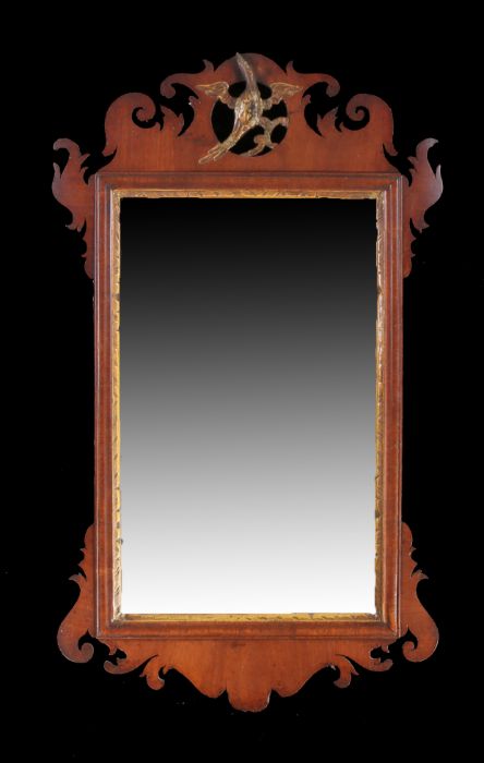George III mahogany fret mirror, the rectangular mirror plate with a scroll fret frame and gilt ho