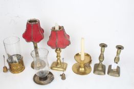 Brass candlesticks, storm lanterns and chamber sticks, to include example with adjustable stem,