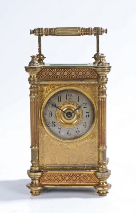 French gilt brass carriage clock, early 20th Century, the reeded swing handle above a bevelled