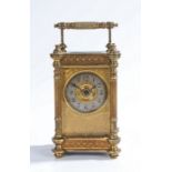 French gilt brass carriage clock, early 20th Century, the reeded swing handle above a bevelled