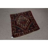 Middle Eastern rug, the blue ground with diamond pattern centre and stylised foliate border, 88cm